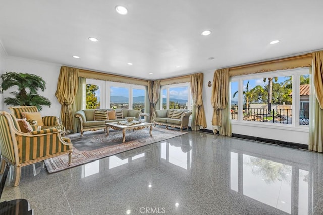 unfurnished living room with recessed lighting, a healthy amount of sunlight, and granite finish floor