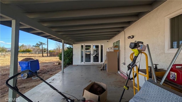 view of patio featuring fence