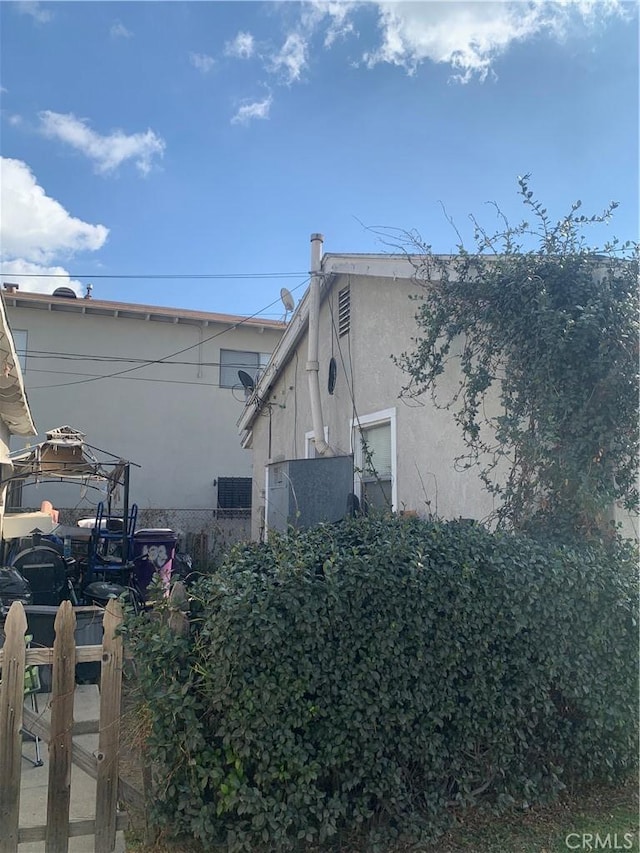 view of home's exterior with stucco siding