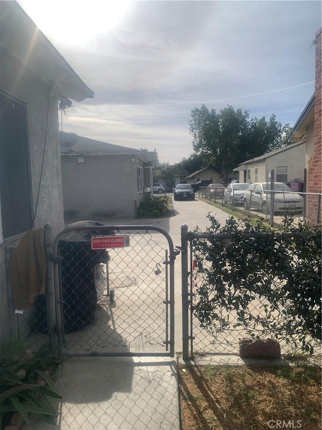 view of gate featuring fence