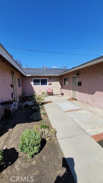 exterior space with a patio and stucco siding