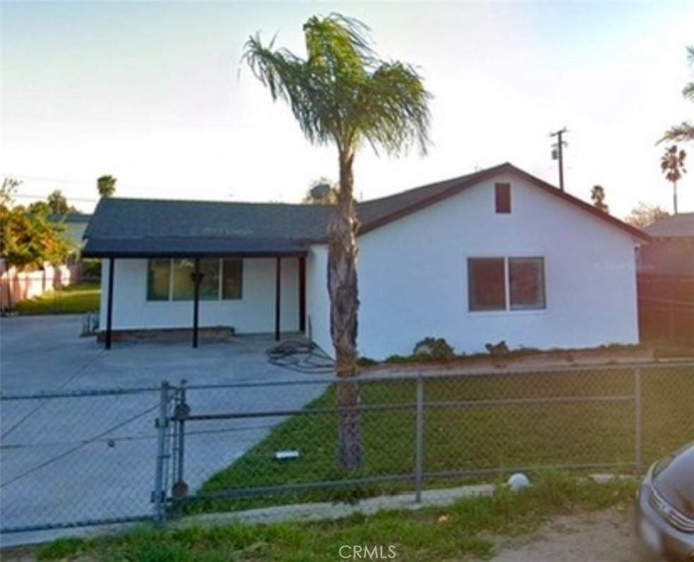 view of front of property with fence private yard and a gate