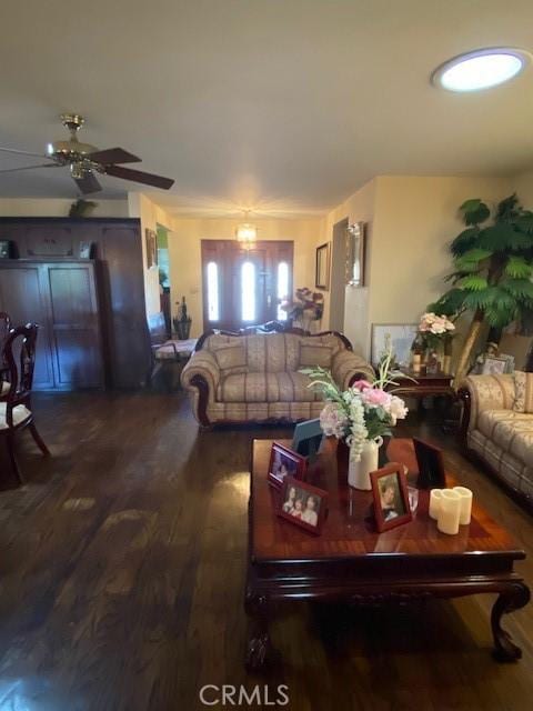 living room with ceiling fan and wood finished floors