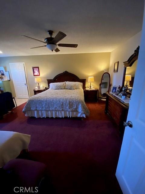 carpeted bedroom with a ceiling fan