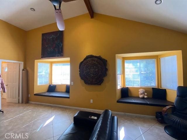 living room featuring beamed ceiling, baseboards, high vaulted ceiling, and tile patterned flooring