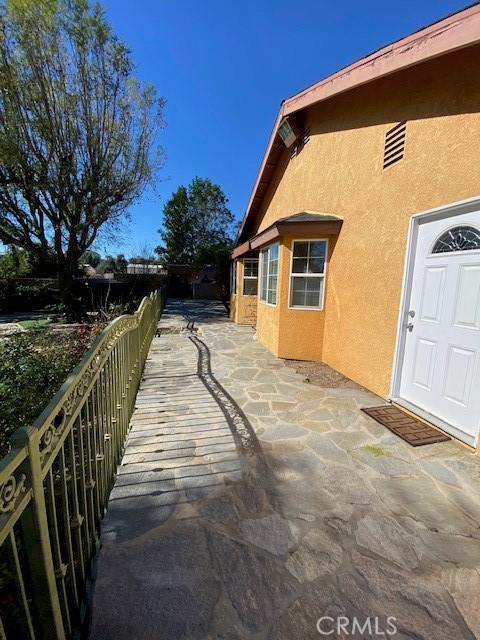 view of property exterior with a patio and stucco siding