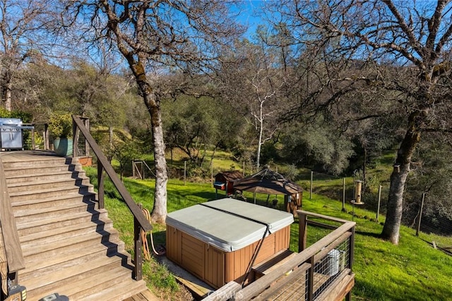 view of yard featuring a gazebo, a hot tub, stairs, and a deck