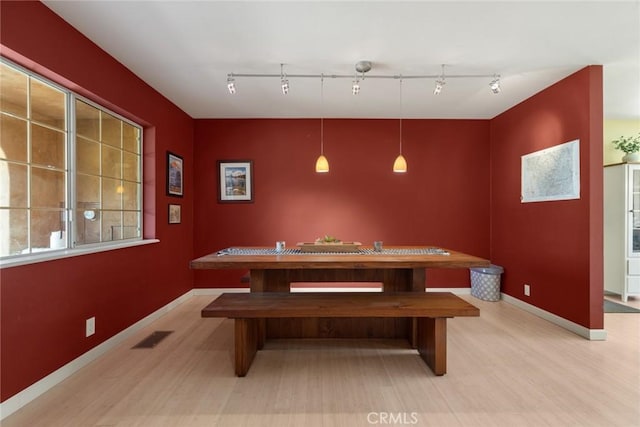 game room with visible vents, baseboards, and light wood finished floors