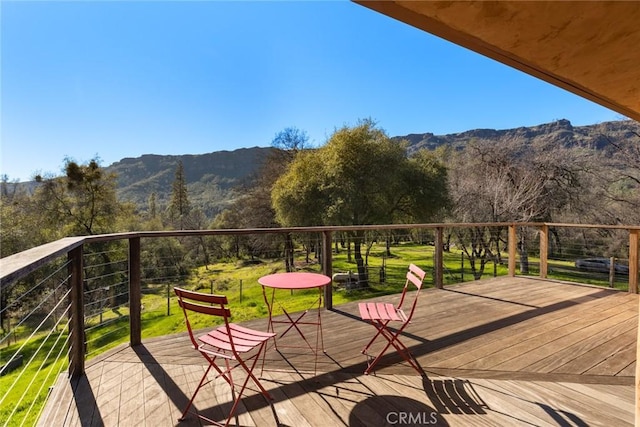 wooden terrace featuring a mountain view