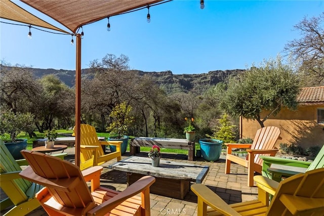 view of patio / terrace with a mountain view