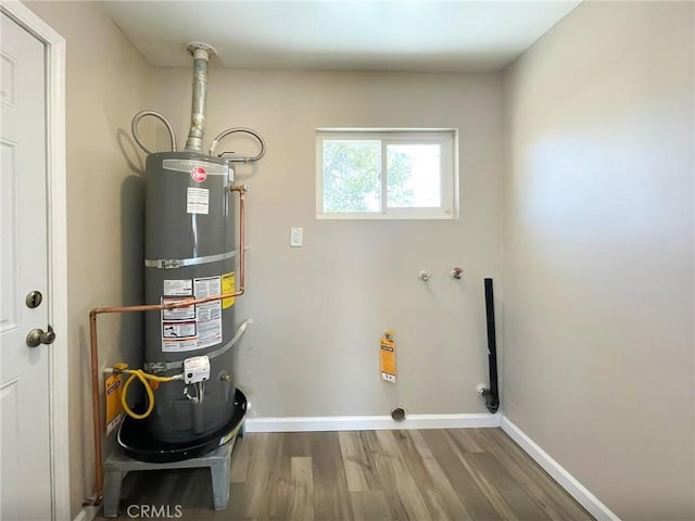 utility room featuring water heater