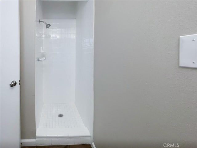 bathroom with a shower stall