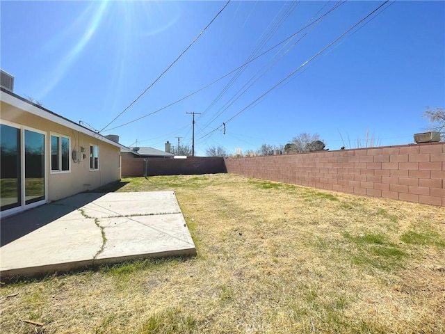 view of yard featuring a patio and a fenced backyard