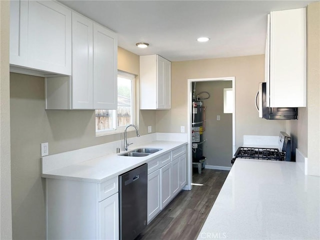 45541 Sancroft Ave, Lancaster, CA 93535 - kitchen with appliances with stainless steel finishes, a sink, light countertops, white cabinets, and dark wood finished floors