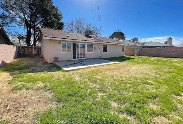 45541 Sancroft Ave, Lancaster, CA 93535 - rear view of house with stucco siding and a patio area