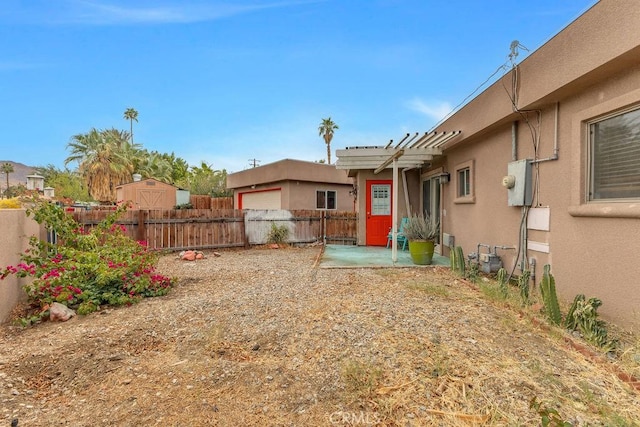 view of yard featuring a patio and fence