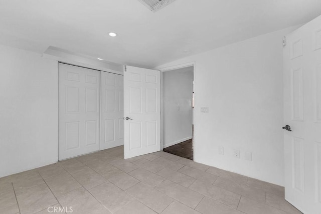 unfurnished room featuring light tile patterned flooring, recessed lighting, and visible vents