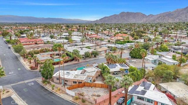 birds eye view of property featuring a mountain view and a residential view