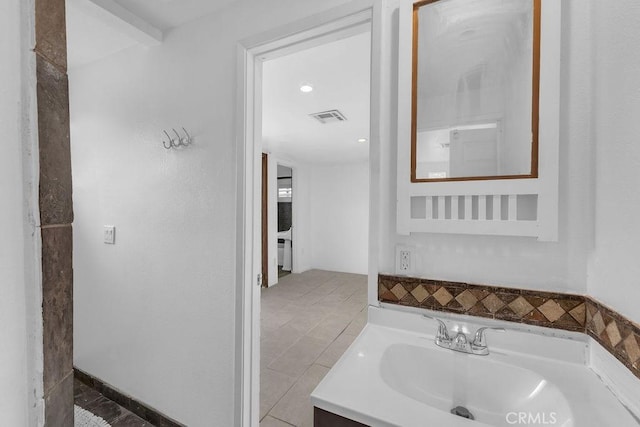 bathroom featuring visible vents and vanity