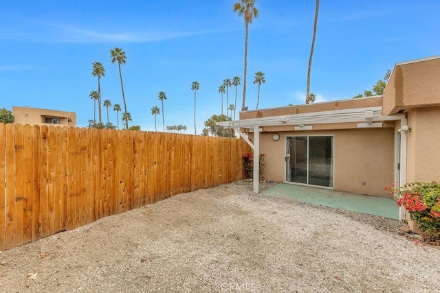 view of yard featuring a patio area and fence