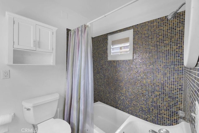 full bath with shower / bath combo with shower curtain and toilet