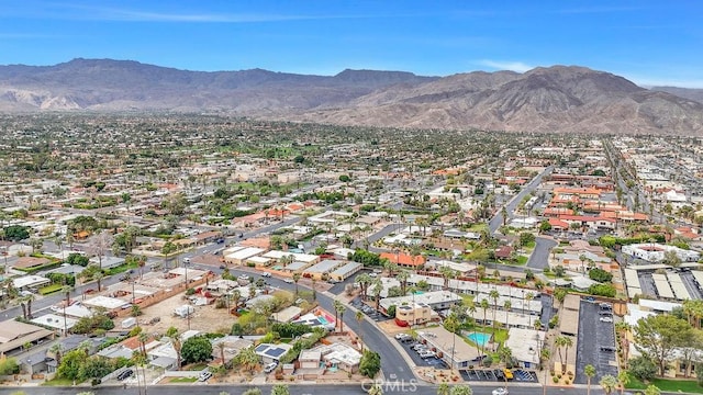 drone / aerial view featuring a residential view and a mountain view