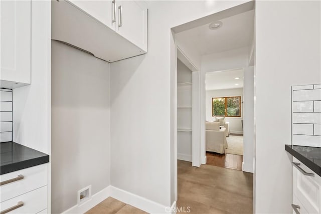 spacious closet with light wood-style flooring