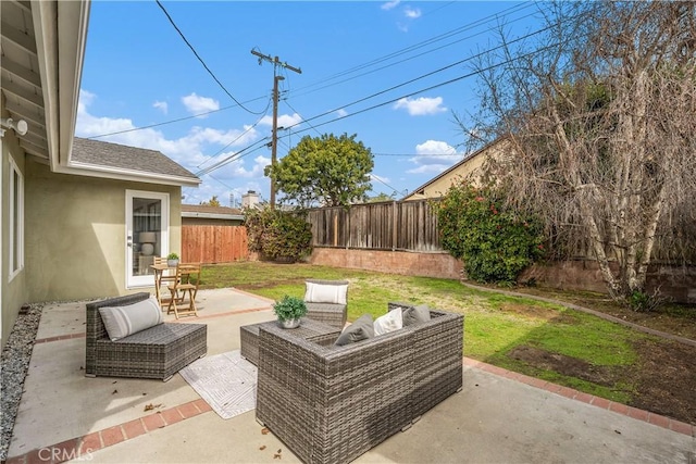 view of patio / terrace featuring an outdoor hangout area and a fenced backyard