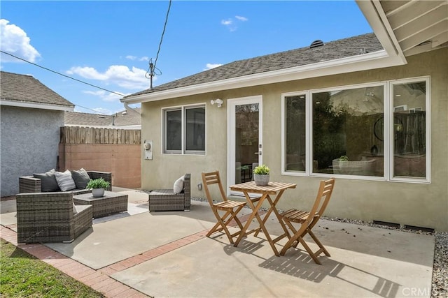 view of patio / terrace with an outdoor living space and fence