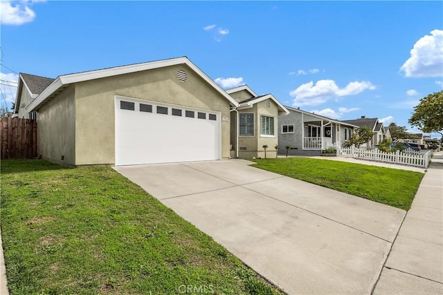 single story home featuring stucco siding, a garage, a front yard, and fence