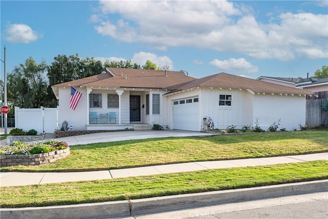 ranch-style house with a front yard, fence, covered porch, concrete driveway, and a garage