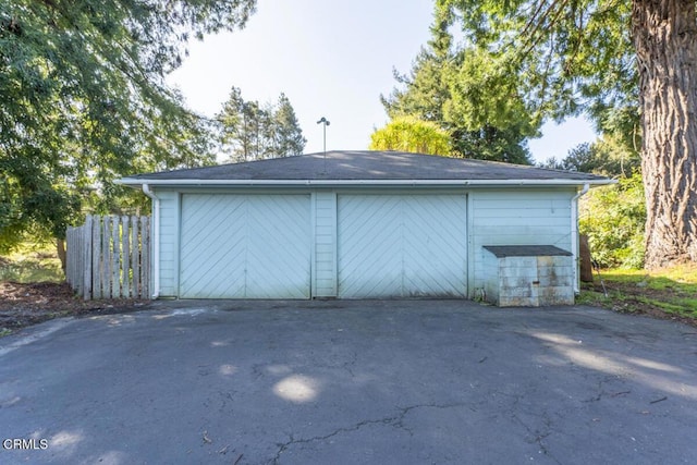 detached garage with fence