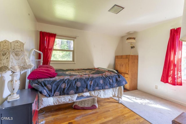 bedroom featuring wood finished floors