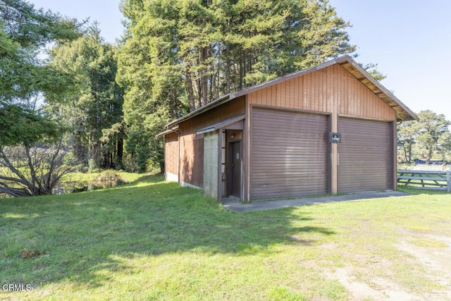 detached garage featuring fence