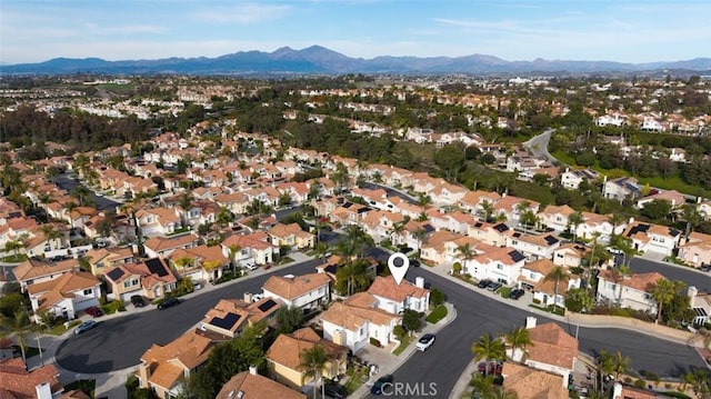 birds eye view of property with a residential view and a mountain view