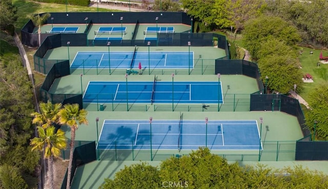 view of tennis court with fence