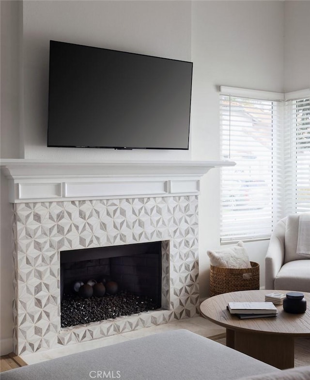 details featuring a tiled fireplace