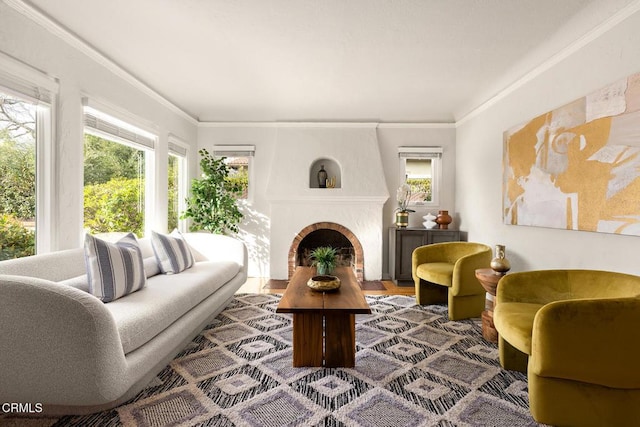 living area featuring a fireplace and crown molding