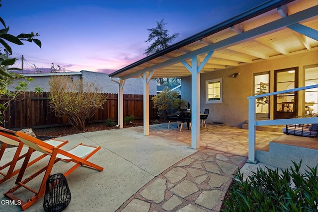 view of patio featuring fence