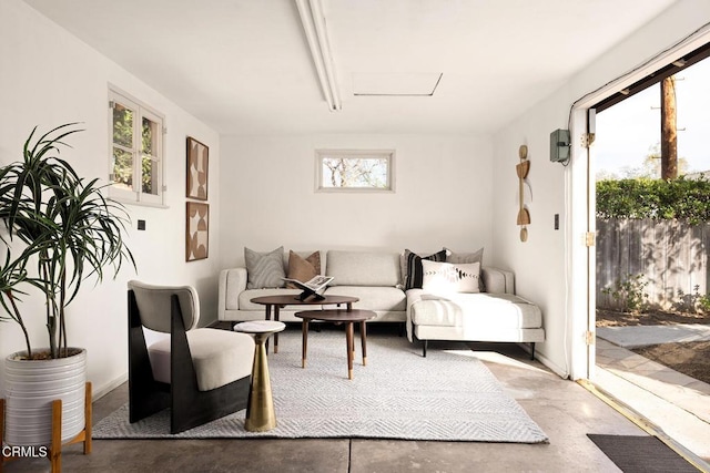 living area featuring concrete flooring