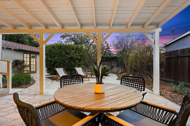 view of patio featuring outdoor dining space and a fenced backyard