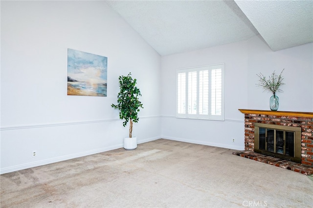 unfurnished living room with baseboards, carpet, vaulted ceiling, a fireplace, and a textured ceiling