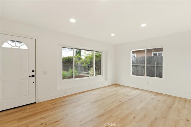 foyer entrance featuring recessed lighting, baseboards, and wood finished floors