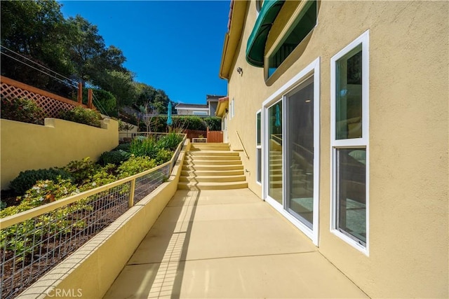 balcony featuring stairs