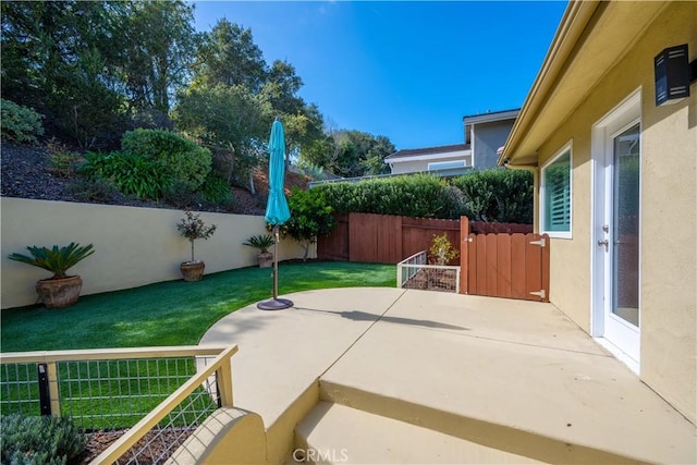 view of patio featuring fence