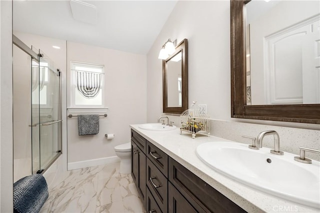 full bath featuring a sink, a shower with shower door, toilet, and marble finish floor