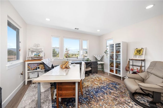 office space featuring recessed lighting, wood finished floors, and baseboards