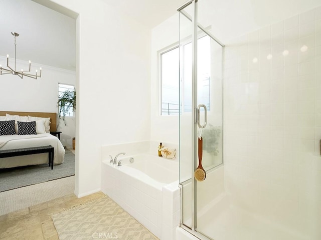 bathroom featuring ensuite bath, an inviting chandelier, a stall shower, tile patterned flooring, and a garden tub