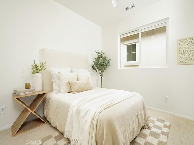 bedroom featuring carpet flooring, baseboards, and visible vents