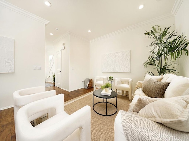 living area with recessed lighting, wood finished floors, baseboards, and ornamental molding